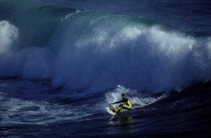 5. He’s surfing in the ocean.